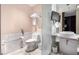 Elegant bathroom featuring marble accents, modern fixtures, and a separate toilet area at 4381 W Flamingo Rd # 18320, Las Vegas, NV 89103