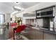 Modern kitchen features stainless steel appliances, a cooktop, and an island with seating at 4381 W Flamingo Rd # 18320, Las Vegas, NV 89103