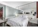 Modern main bedroom with a large mirrored wall, accent lighting and sleek minimalist furniture at 4381 W Flamingo Rd # 18320, Las Vegas, NV 89103