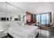 Spacious main bedroom boasts city views, a large bed, and a comfortable seating area at 4381 W Flamingo Rd # 18320, Las Vegas, NV 89103