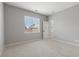 Comfortable bedroom features plush carpeting, a window with blinds, and a neutral color scheme for relaxation at 4413 Pioche Ave, North Las Vegas, NV 89032