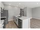 Well-appointed kitchen features stainless steel appliances, a center island with sink, and ample counter space at 4413 Pioche Ave, North Las Vegas, NV 89032