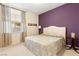 Cozy bedroom featuring a queen-size bed, bright window and a calming color scheme at 4649 Bird View Ct, Las Vegas, NV 89129