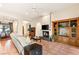 Comfortable living room with a fireplace, custom cabinets, and views to the outdoor dining area at 4649 Bird View Ct, Las Vegas, NV 89129