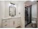 Elegant bathroom featuring a vanity with gold hardware and a glass-enclosed shower at 4669 Winfield Dr, Las Vegas, NV 89147