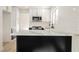 Modern kitchen boasts white cabinets, granite countertops, stainless steel appliances, and subway tile backsplash at 4669 Winfield Dr, Las Vegas, NV 89147
