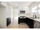 Updated kitchen featuring white cabinets, stainless steel appliances, and modern countertops at 4669 Winfield Dr, Las Vegas, NV 89147