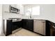 Modern kitchen featuring stainless steel appliances, white cabinets, and stylish fixtures at 4669 Winfield Dr, Las Vegas, NV 89147