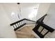 Elegant staircase showcasing modern black railings and bright interior, creating a welcoming space at 4669 Winfield Dr, Las Vegas, NV 89147