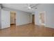 Bedroom with wood floors, ceiling fan, closet and ensuite bath offers space to relax at 472 Staghorn Pass Ave, Las Vegas, NV 89183