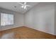 Clean, bright bedroom with neutral walls, hardwood floors, and window with blinds at 472 Staghorn Pass Ave, Las Vegas, NV 89183