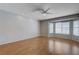 Large, bright bedroom boasts wood floors, ceiling fan, and sunny bay window at 472 Staghorn Pass Ave, Las Vegas, NV 89183
