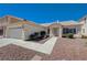 Single story home with a two car garage, low maintenance yard and desert landscaping at 472 Staghorn Pass Ave, Las Vegas, NV 89183