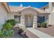 Inviting front entrance with security door, desert landscaping, and a tiled roof at 472 Staghorn Pass Ave, Las Vegas, NV 89183