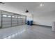 Clean garage with epoxy flooring, an automatic door opener, and plenty of space for parking at 472 Staghorn Pass Ave, Las Vegas, NV 89183
