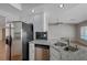 Kitchen featuring stainless steel appliances, granite countertops, and a stylish tile backsplash at 472 Staghorn Pass Ave, Las Vegas, NV 89183