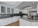 Well-lit kitchen featuring granite countertops, a tile backsplash, and modern stainless steel appliances at 472 Staghorn Pass Ave, Las Vegas, NV 89183