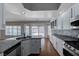 Bright kitchen with island, stainless steel appliances, and view of the outdoor pool at 472 Staghorn Pass Ave, Las Vegas, NV 89183