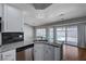 Bright kitchen featuring stainless steel appliances and a breakfast bar with views of the pool at 472 Staghorn Pass Ave, Las Vegas, NV 89183