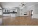 Open-concept living area with fireplace and seamless flow to the kitchen and dining area at 472 Staghorn Pass Ave, Las Vegas, NV 89183