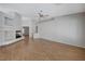 Spacious living room with a modern fireplace and neutral paint, complemented by elegant wood floors at 472 Staghorn Pass Ave, Las Vegas, NV 89183