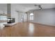 Spacious living room featuring beautiful hardwood floors, a fireplace, and plenty of natural light at 472 Staghorn Pass Ave, Las Vegas, NV 89183