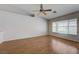 Living room featuring wood floors, neutral paint and a large window offering ample natural light at 472 Staghorn Pass Ave, Las Vegas, NV 89183