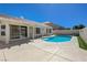 Inviting backyard with a refreshing private pool, covered patio, and seamless indoor-outdoor living at 472 Staghorn Pass Ave, Las Vegas, NV 89183
