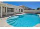 Inviting backyard pool with surrounding concrete patio, ideal for outdoor relaxation and entertainment at 472 Staghorn Pass Ave, Las Vegas, NV 89183