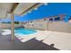 Beautiful backyard oasis featuring a sparkling pool and expansive patio, perfect for entertaining outdoors at 472 Staghorn Pass Ave, Las Vegas, NV 89183
