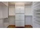 Spacious walk-in closet with built-in shelving and drawers, offering ample storage space at 472 Staghorn Pass Ave, Las Vegas, NV 89183