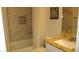 Well-lit bathroom features a shower with stylish tile, a bathtub, and granite countertop at 4821 Black Bear Rd # 104, Las Vegas, NV 89149
