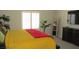 Bedroom with a large window, plant and dark-toned furniture at 4821 Black Bear Rd # 104, Las Vegas, NV 89149