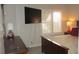 Cozy bedroom with a flat-screen television, shutters, and side table with lamp at 4821 Black Bear Rd # 104, Las Vegas, NV 89149