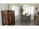 Dining area featuring table and chairs, cabinet, and window with shutters at 4821 Black Bear Rd # 104, Las Vegas, NV 89149