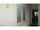Inviting entryway with white shutters, and a secure door leading into the home at 4821 Black Bear Rd # 104, Las Vegas, NV 89149