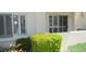 Attractive exterior view with well-maintained landscape, including bushes, and shuttered windows at 4821 Black Bear Rd # 104, Las Vegas, NV 89149