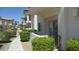 Exterior of the home with well-manicured bushes and covered patio or balcony space at 4821 Black Bear Rd # 104, Las Vegas, NV 89149