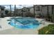 Community pool surrounded by well-maintained landscaping and nearby buildings at 4821 Black Bear Rd # 104, Las Vegas, NV 89149