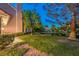 Home backyard featuring a pond and mature trees at 5010 Crooked Stick Way, Las Vegas, NV 89113