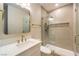 Bright bathroom featuring a glass shower, vanity, and gold fixtures at 5010 Crooked Stick Way, Las Vegas, NV 89113