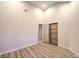 Bright bedroom showcasing hardwood floors, a closet, and white walls at 5010 Crooked Stick Way, Las Vegas, NV 89113