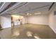 Spacious garage featuring an epoxy floor and laundry equipment at 5010 Crooked Stick Way, Las Vegas, NV 89113