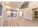 Spacious open concept living room with hardwood floors and plenty of natural light at 5010 Crooked Stick Way, Las Vegas, NV 89113