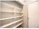 Walk-in pantry with multiple shelves to maximize storage at 5010 Crooked Stick Way, Las Vegas, NV 89113