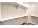 Walk-in closet with white walls and storage shelves at 5010 Crooked Stick Way, Las Vegas, NV 89113