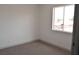 Bright bedroom features a large window and neutral carpet at 5086 Mountain Vista St, Las Vegas, NV 89120