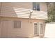 Beige exterior features white doors, windows, and a satellite dish at 5086 Mountain Vista St, Las Vegas, NV 89120