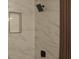 Bathroom shower with new fixtures and marble tiling at 5086 Mountain Vista St, Las Vegas, NV 89120