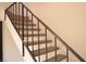 Carpeted staircase with black railing leads to the next level at 5086 Mountain Vista St, Las Vegas, NV 89120